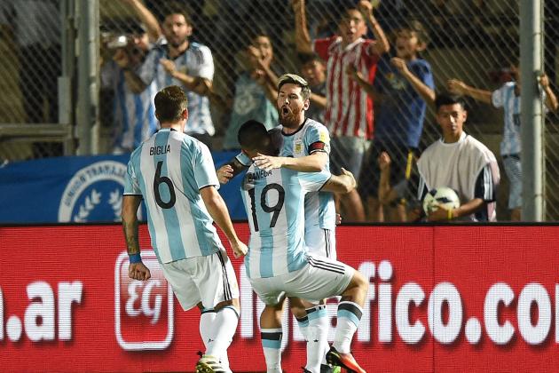 Argentina's Lionel Messi (R) celebrates with teammates after scoring against Colombia during their 2018 FIFA World Cup qualifier football match in San Juan, Argentina, on November 15, 2016. / AFP / EITAN ABRAMOVICH        (Photo credit should read EITAN ABRAMOVICH/AFP/Getty Images)