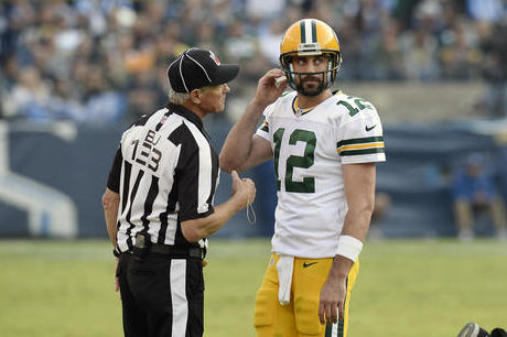 Back judge Steve Freeman (133) talks with Green Bay Packers quarterback Aaron Rodgers (12) in the second half of an NFL football game against the Tennessee Titans Sunday, Nov. 13, 2016, in Nashville, Tenn. (AP Photo/Mark Zaleski)
