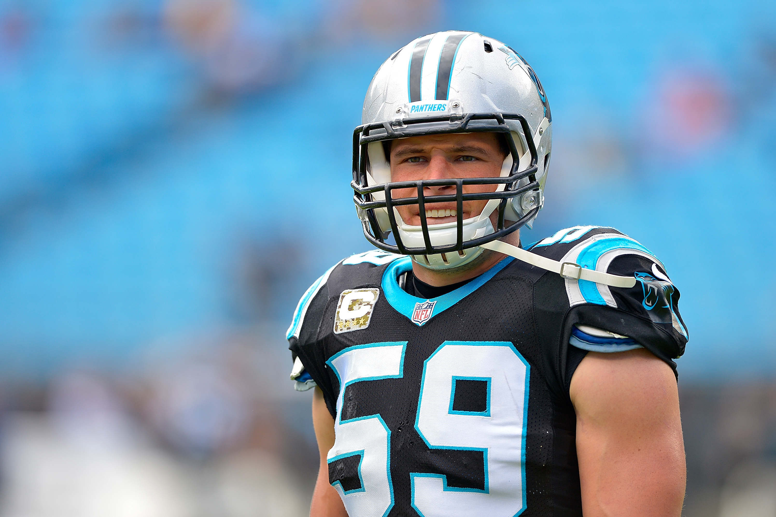 Carolina Panthers' Luke Kuechly #59 walks off the field against