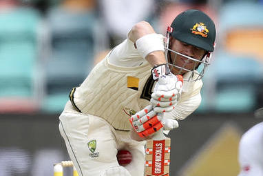 The ball gets past the bat of Australia's David Warner during their cricket test match against South Africa in Hobart, Australia, Monday, Nov. 14, 2016. (AP Photo/Rick Rycroft)