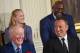NBA star Michael Jordan (R top) and rock icon Bruce Springsteen (R) laugh along with some of the other 21 recipients of the Presidential Medal of Freedom as US President Barack Obama speaks before presenting the nation's highest civilian honor, during a ceremony in the East Room of the White House in Washington, DC, November 22, 2016. / AFP / SAUL LOEB (Photo credit should read SAUL LOEB/AFP/Getty Images)