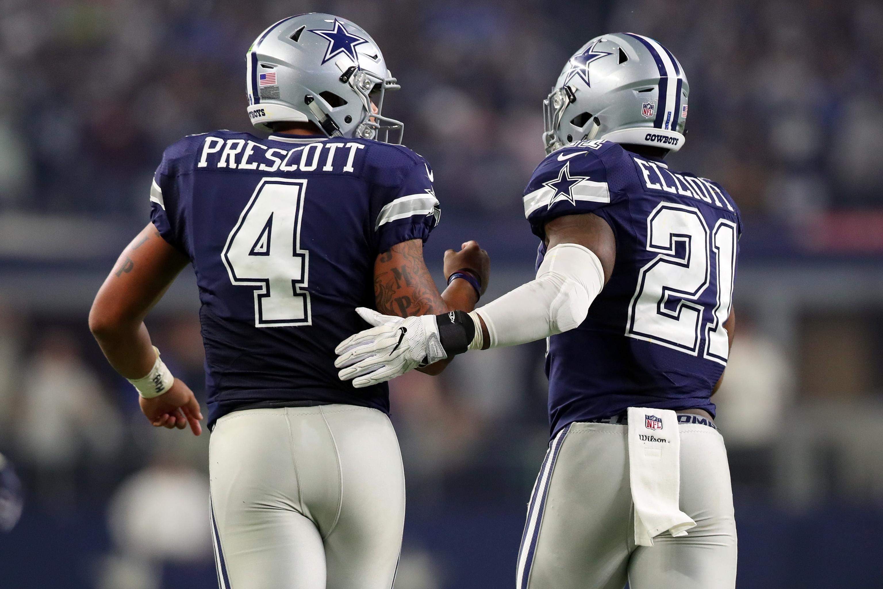 Dak Prescott, Ezekiel Elliott embrace at midfield after Cowboys-Patriots  game