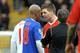 Blackburn Rovers' Senegal midfielder El Hadji Diouf (L) exchanges words with Liverpool's English midfielder Steven Gerrard during the English Premier League football match football match at Anfield, Liverpool, north-west, England, on February 28, 2010. AFP PHOTO/ ANDREW YATES. --- RESTRICTED TO EDITORIAL USE Additional licence required for any commercial/promotional use or use on TV or internet (except identical online version of newspaper) of Premier League/Football League photos. Tel DataCo +44 207 2981656. Do not alter/modify photo (Photo credit should read ANDREW YATES/AFP/Getty Images)