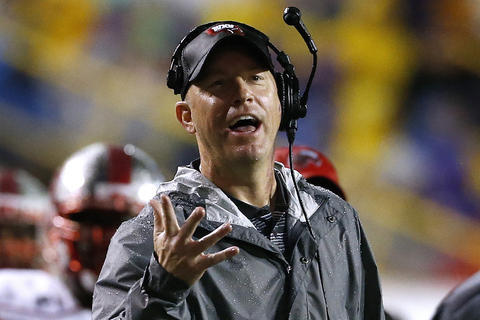 FILE - In this Oct. 24, 2015, file photo, Western Kentucky head coach Jeff Brohm gestures during the first half an NCAA college football game against LSU in Baton Rouge, La. Western Kentucky knows it will be tough trying to follow up a 12-win season that clinched Conference USA, a second straight bowl victory and No. 24 final ranking. Especially since the Hilltoppers must replace key personnel such as career passing leader Brandon Doughty and tight end Tyler Higbee, both of whom are now in NFL training camps. But WKU has plenty of talent left for coach Brohm on both sides of the ball to expect continued success. (AP Photo/Jonathan Bachman, File)