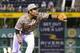 Pittsburgh Pirates' Jung Ho Kang fields a ball hit by Cincinnati Reds' Jose Peraza during the fourth inning of a baseball game in Pittsburgh, Thursday, Sept. 8, 2016. Kang threw Peraza out at first on the play (AP Photo/Fred Vuich)