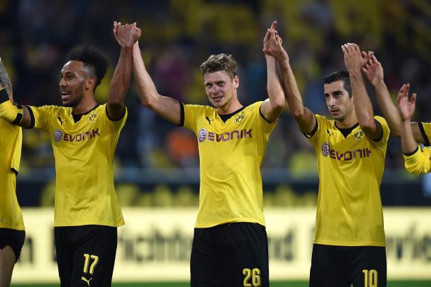 Dortmund´s players including (from L) Gabonese striker Pierre-Emerick Aubameyang, Polish defender Lukasz Piszczek and Armenian midfielder Henrikh Mkhitaryan celebrate after the UEFA Europa League third qualifying round second leg football match between  Borussia Dortmund and Wolfsberger AC on August 6, 2015 in Dortmund, western Germany. Dortmund won the match 5-0 with a hattrick by Armenian midfielder Henrikh Mkhitaryan. AFP PHOTO / PATRIK STOLLARZ        (Photo credit should read PATRIK STOLLARZ/AFP/Getty Images)