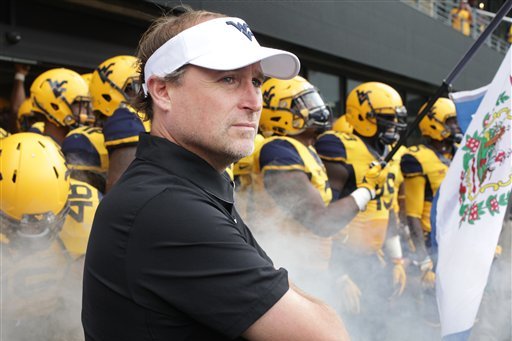 West Virginia head coach Dana Holgorsen during the first half/ second half of an NCAA college football game, Saturday, Oct. 1, 2016, in Morgantown, W.Va. (AP Photo/Raymond Thompson)