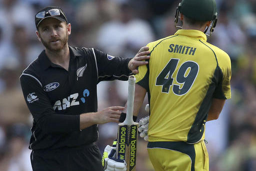 New Zealand's Kane Williamson, left, congratulates Australia's Steven Smith after Smith made 164 runs during their one day international cricket match in Sydney, Australia, Sunday, Dec. 4, 2016. (AP Photo/Rick Rycroft)
