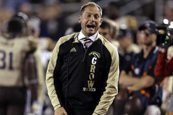 Western Michigan coach P.J. Fleck yells from the sideline during the second half of an NCAA college football game against Ball State in Muncie, Ind., Tuesday, Nov. 1, 2016. (AP Photo/Michael Conroy)