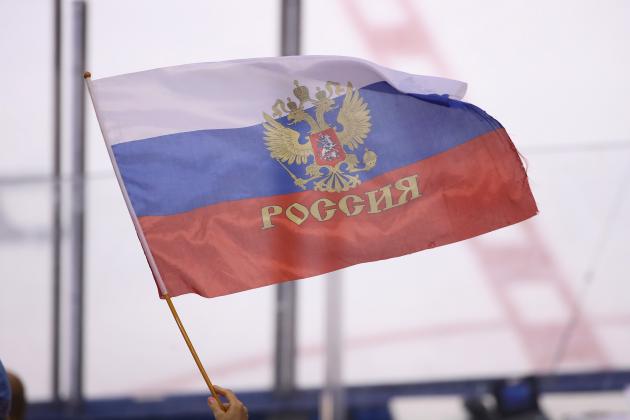 TORONTO, ON - SEPTEMBER 22: A fan of Team Russia waves a Russian flag against Team Finland during the World Cup of Hockey tournament at the Air Canada Centre on September 22, 2016 in Toronto, Canada. (Photo by Tom Szczerbowski/Getty Images)