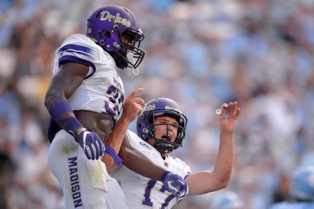 CHAPEL HILL, NC - SEPTEMBER 17:  Khalid Abdullah #32 celebrates with quarterback Bryan Schor #17 of the James Madison Dukes after scoring a touchdown against the North Carolina Tar Heels during the game at Kenan Stadium on September 17, 2016 in Chapel Hill, North Carolina.  (Photo by Grant Halverson/Getty Images)
