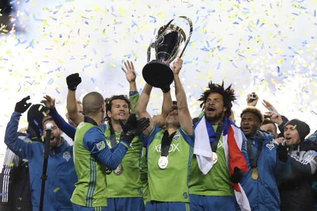 Seattle Sounders celebrate their MLS Cup final victory over Toronto FC at BMO Field on December 10, 2016 in Toronto. / AFP / Cole Burston (Photo credit should read COLE BURSTON/AFP/Getty Images)