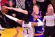 Kristaps Porzingis of the New York Knicks blocks an attempt to score from D'Angelo Russell of the Los Angeles Lakers on December 11, 2016 during their NBA match in Los Angeles, California. / AFP / Frederic J. BROWN (Photo credit should read FREDERIC J. BROWN/AFP/Getty Images)
