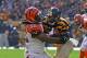 PITTSBURGH, PA - NOVEMBER 1: Linebacker Vontaze Burfict #55 of the Cincinnati Bengals tackles running back Le'Veon Bell #26 of the Pittsburgh Steelers during a game at Heinz Field on November 1, 2015 in Pittsburgh, Pennsylvania. The Bengals defeated the Steelers 16-10. (Photo by George Gojkovich/Getty Images)