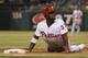 Philadelphia Phillies' Odubel Herrera looks up after sliding back into first base during the sixth inning of a baseball game against the Washington Nationals, Monday, Aug. 29, 2016, in Philadelphia. The Nationals won 4-0. (AP Photo/Chris Szagola)