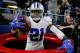 ARLINGTON, TX - DECEMBER 18: Ezekiel Elliott #21 of the Dallas Cowboys celebrates after scoring a touchdown by jumping into a Salvation Army red kettle during the second quarter against the Tampa Bay Buccaneers at AT&T Stadium on December 18, 2016 in Arlington, Texas. (Photo by Tom Pennington/Getty Images)