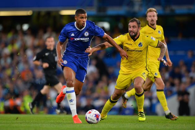 Chelsea's English midfielder Ruben Loftus-Cheek (L) takes on Bristol Rovers' English defender Peter Hartley (R) during the English League Cup second round football match between Chelsea and Bristol Rovers at Stamford Bridge in London on August 23, 2016. / AFP / GLYN KIRK / RESTRICTED TO EDITORIAL USE. No use with unauthorized audio, video, data, fixture lists, club/league logos or 'live' services. Online in-match use limited to 75 images, no video emulation. No use in betting, games or single club/league/player publications.  /         (Photo credit should read GLYN KIRK/AFP/Getty Images)