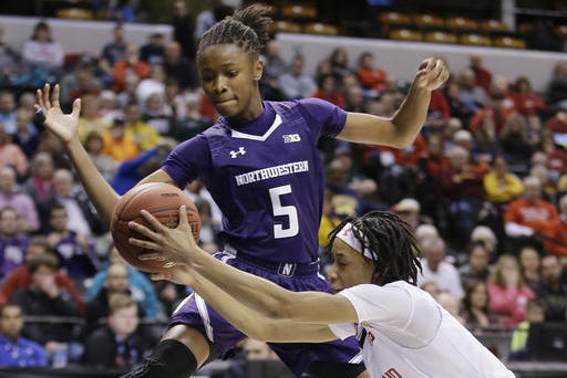 FILE - In this March 5, 2016, file photo, Maryland's Brene Moseley (3) and Northwestern's Jordan Hankins (5) go for a loose ball during an NCAA college basketball game at the Big Ten Conference tournament in Indianapolis. Hankins has been found dead in her room at the university. The university said in a statement that Hankins' body was found Monday afternoon, Jan. 9, 2017. The statement from spokesman Carsten Parmenter said there is no indication of foul play or