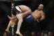 Brock Lesnar, left, takes down Mark Hunt during their heavyweight mixed martial arts bout at UFC 200, Saturday, July 9, 2016, in Las Vegas. (AP Photo/John Locher)