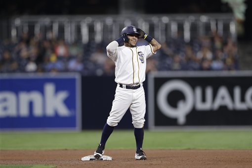 San Diego Padres' Alexi Amarista smiles after hitting a two-RBI double during the fourth inning of a baseball game against the Arizona Diamondbacks Monday, Sept. 19, 2016, in San Diego. (AP Photo/Gregory Bull)