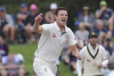 Australia’s Josh Hazelwood reacts while bowling against New Zealand’s Kane Williamson on the fourth day of the second international cricket test match at Hagley Park Oval in Christchurch, New Zealand, Tuesday, Feb. 23, 2016. (Ross Setford/SNPA via AP) NEW ZEALAND OUT