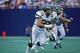 MEADOWLANDS - SEPTEMBER 18: Defensive end Mark Gastineau #99 of the New York Jets runs on the field during a game against the Houston Oilers on September 18, 1988 at Giants Stadium in the Meadowlands, East Rutherford, New Jersey. (Photo by Rick Stewart/Getty Images)
