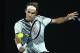 MELBOURNE, AUSTRALIA - JANUARY 26: Roger Federer of Switzerland plays a backhand in his semifinal match against Stan Wawrinka of Switzerland on day 11 of the 2017 Australian Open at Melbourne Park on January 26, 2017 in Melbourne, Australia. (Photo by Clive Brunskill/Getty Images)