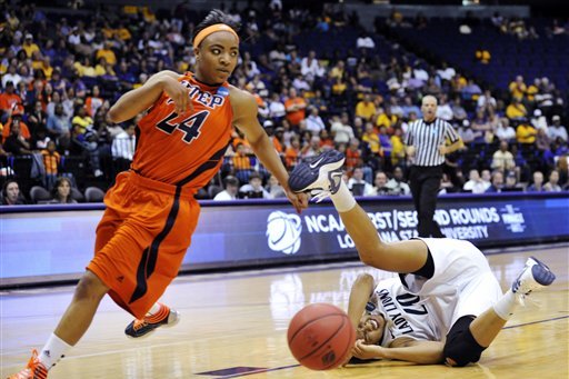 Penn State guard Alex Bentley (20) tumbles on the floor after being tripped up by UTEP guard Jenzel Nash (24), who was called for the foul, during the second half of a first-round NCAA women's tournament college basketball game, Sunday, March 18, 2012, in Baton Rouge, La. Penn State won 85-77. (AP Photo/Bill Feig)