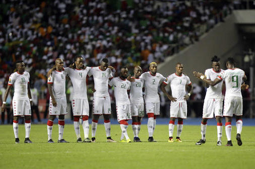 Burkina Faso players stand together during a penalty shoot out at the end of the African Cup of Nations semifinal soccer match between Burkina Faso and Egypt at the Stade de l'Amitie, in Libreville, Gabon, Wednesday, Feb. 1, 2017. Egypt defeated Burkins Faso 4-3 in a penalty shoot out after the game ended tied 1-1. (AP Photo/Sunday Alamba)