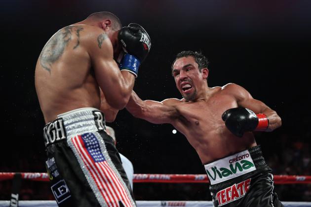 INGLEWOOD, CA - MAY 17:  Juan Manuel Marquez throws a right hand at Mike Alvarado at The Forum on May 17, 2014 in Inglewood, California.  (Photo by Jeff Gross/Getty Images)