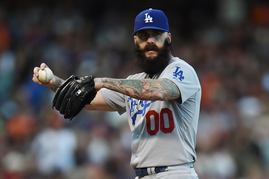 Los Angeles Dodgers relief pitcher Brian Wilson has tattoos on his hand and  arm as he stretches before a baseball game Washington Nationals at  Nationals Park, Monday, May 5, 2014, in Washington. (