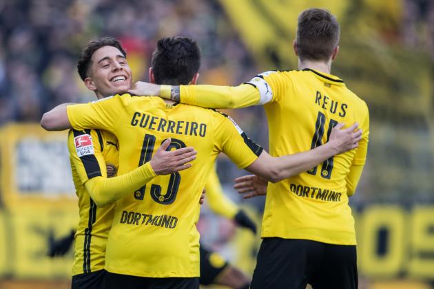 DARMSTADT, GERMANY - FEBRUARY 11:  Raphael Guerreiro of Dortmund (C) celebrates his team's first goal with his team mates Emre Mor (L) and Marco Reus (R) during the Bundesliga match between SV Darmstadt 98 and Borussia Dortmund at Jonathan Heimes Stadion am Boellenfalltor on February 11, 2017 in Darmstadt, Germany.  (Photo by Simon Hofmann/Getty Images)