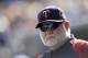 Minnesota Twins manager Ron Gardenhire is seen in the dugout during a baseball game against the Detroit Tigers in Detroit, Sunday, Sept. 28, 2014. (AP Photo/Carlos Osorio)