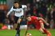 LIVERPOOL, ENGLAND - FEBRUARY 11: Dele Alli of Tottenham Hotspur goes past Jordan Henderson of Liverpool during the Premier League match between Liverpool and Tottenham Hotspur at Anfield on February 11, 2017 in Liverpool, England. (Photo by Mike Hewitt/Getty Images for Tottenham Hotspur FC)