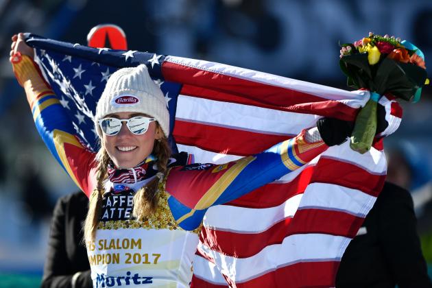 US skier Mikaela Shiffrin holds a US flag as she celebrates winning the women's slalom race at the 2017 FIS Alpine World Ski Championships in St Moritz on February 18, 2017. / AFP / Fabrice COFFRINI        (Photo credit should read FABRICE COFFRINI/AFP/Getty Images)