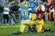 PASADENA, CA - NOVEMBER 22: Takkarist McKinley #98 of the UCLA Bruins celebrates after sacking quarterback Cody Kessler #6 of the USC Trojans in the third quarter at the Rose Bowl on November 22, 2014 in Pasadena, California. UCLA on 38-20. (Photo by Stephen Dunn/Getty Images)
