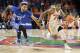 Florida guard Kasey Hill (0) dribbles past Kentucky guard Mychal Mulder (11) on a fast break during the second half of an NCAA college basketball game in Gainesville, Fla., Saturday, Feb. 4, 2017. Florida won 88-66. (AP Photo/Ron Irby)