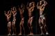 Professional bodybuilders pose on stage during a competition at the Arnold Classic Brazil 2015 in Rio de Janeiro, Brazil, on May 30, 2015. The 3rd annual multi-disciplinary sports competition is named after Austrian-American actor, politician and former bodybuilder Arnold Schwarzenegger. AFP PHOTO / YASUYOSHI CHIBA (Photo credit should read YASUYOSHI CHIBA/AFP/Getty Images)