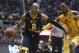 West Virginia guard Jevon Carter (2) drives to the basket while being defended by Iowa State guard Monte Morris (11) during the second half of an NCAA college basketball game, Friday, March 3, 2017, in Morgantown, W.Va. West Virginia defeated Iowa State 87-76. (AP Photo/Raymond Thompson)