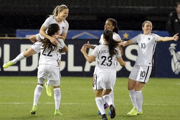 French forward Eugenie Le Sommer jumps into her teammate's arms after scoring the second goal during the She Believes Cup USA vs. France match at RFK Stadium March 7, 2017 in Washington, DC. / AFP PHOTO / Brendan Smialowski        (Photo credit should read BRENDAN SMIALOWSKI/AFP/Getty Images)