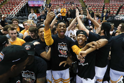 Northern Kentucky players celebrate their 59-53 victory over Milwaukee after the Horizon League NCAA college basketball tournament championship game in Detroit, Tuesday, March 7, 2017. (AP Photo/Paul Sancya)