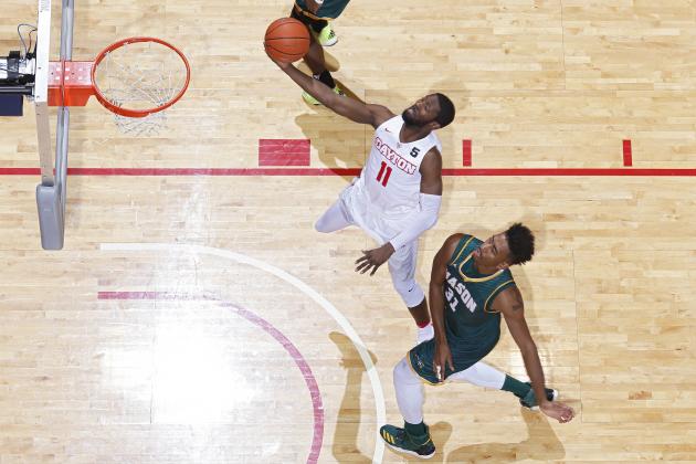 DAYTON, OH - FEBRUARY 21: Scoochie Smith #11 of the Dayton Flyers lays the ball in ahead of Jalen Jenkins #31 of the George Mason Patriots in the second half of the game at UD Arena on February 21, 2017 in Dayton, Ohio. Dayton defeated George Mason 83-70. (Photo by Joe Robbins/Getty Images)