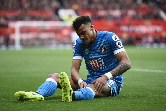 Bournemouth's English defender Tyrone Mings lies injured during the English Premier League football match between Manchester United and Bournemouth at Old Trafford in Manchester, north west England, on March 4, 2017. / AFP PHOTO / Oli SCARFF / RESTRICTED TO EDITORIAL USE. No use with unauthorized audio, video, data, fixture lists, club/league logos or 'live' services. Online in-match use limited to 75 images, no video emulation. No use in betting, games or single club/league/player publications.  /         (Photo credit should read OLI SCARFF/AFP/Getty Images)