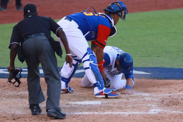 ZAPOPAN, MEXICO - MARCH 11: Salvador Perez #15 of Venezuela tags out Drew Butera #09 of Italy in the bottom of the seventh inning during the World Baseball Classic Pool D Game 3 between Venezuela and Italy at Panamericano Stadium on March 11, 2017 in Zapopan, Mexico. (Photo by Miguel Tovar/Getty Images)