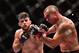 Kelvin Gastelum (left) lands a straight left on Vitor Belfort.