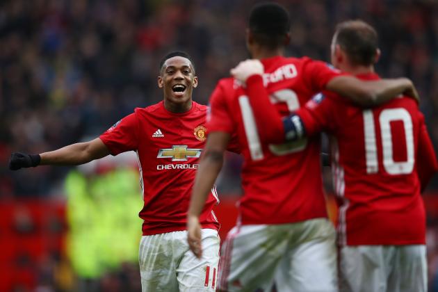 MANCHESTER, ENGLAND - JANUARY 07:  Marcus Rashford of Manchester United celebrates with wayne Rooney and Anthony Martial of Manchester United after scoring his first and his sides third goal during the Emirates FA Cup third round match between Manchester United and Reading at Old Trafford on January 7, 2017 in Manchester, England.  (Photo by Clive Brunskill/Getty Images)