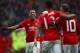 MANCHESTER, ENGLAND - JANUARY 07: Marcus Rashford of Manchester United celebrates with wayne Rooney and Anthony Martial of Manchester United after scoring his first and his sides third goal during the Emirates FA Cup third round match between Manchester United and Reading at Old Trafford on January 7, 2017 in Manchester, England. (Photo by Clive Brunskill/Getty Images)