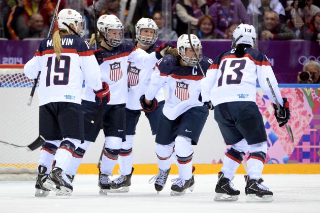 SOCHI, RUSSIA - FEBRUARY 20:  Meghan Duggan #10 of the United States celebrates with teammates Julie Chu #13, Kacey Bellamy #22, Jocelyne Lamoureux #17 and Gigi Marvin #19 after scoring a second-period goal during the Ice Hockey Women's Gold Medal Game on day 13 of the Sochi 2014 Winter Olympics at Bolshoy Ice Dome on February 20, 2014 in Sochi, Russia.  (Photo by Harry How/Getty Images)