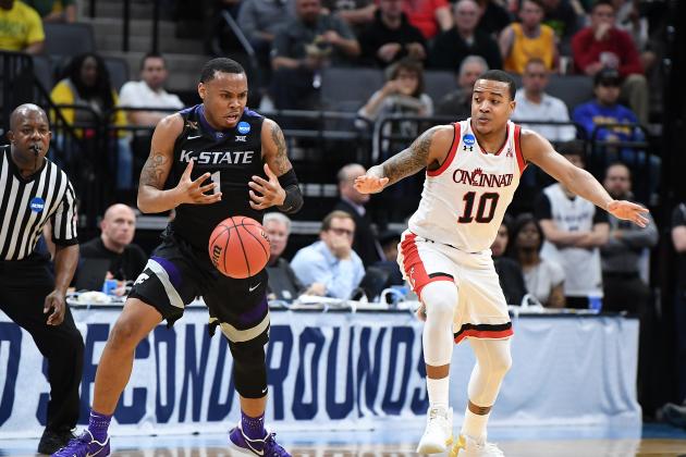 SACRAMENTO, CA - MARCH 17: Carlbe Ervin II #1 of the Kansas State Wildcats is defended by Troy Caupain #10 of the Cincinnati Bearcats during the first round of the 2017 NCAA Men's Basketball Tournament at Golden 1 Center on March 17, 2017 in Sacramento, California.  (Photo by Thearon W. Henderson/Getty Images)