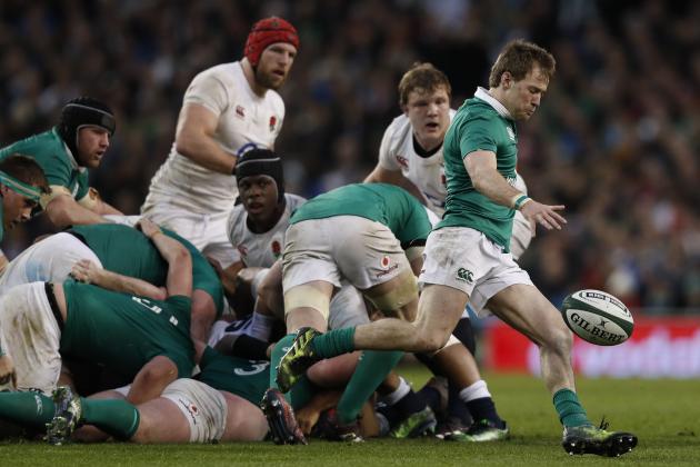 Ireland's scrum-half Kieran Marmion (R) kicks the ball up-field during the Six Nations international rugby union match between Ireland and England at the Aviva Stadium in Dublin on March 18, 2017.   / AFP PHOTO / Adrian DENNIS        (Photo credit should read ADRIAN DENNIS/AFP/Getty Images)